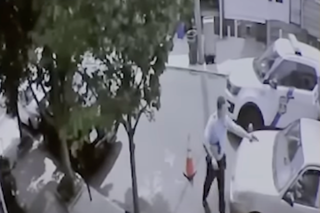<p>Surveillance footage shows Philadelphia police officer Mark Dial approach Eddie Irizarry’s car before opening fire</p>