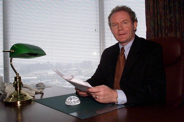 The late Martin McGuinness at his desk in the Department of Education in 1999 (PA)