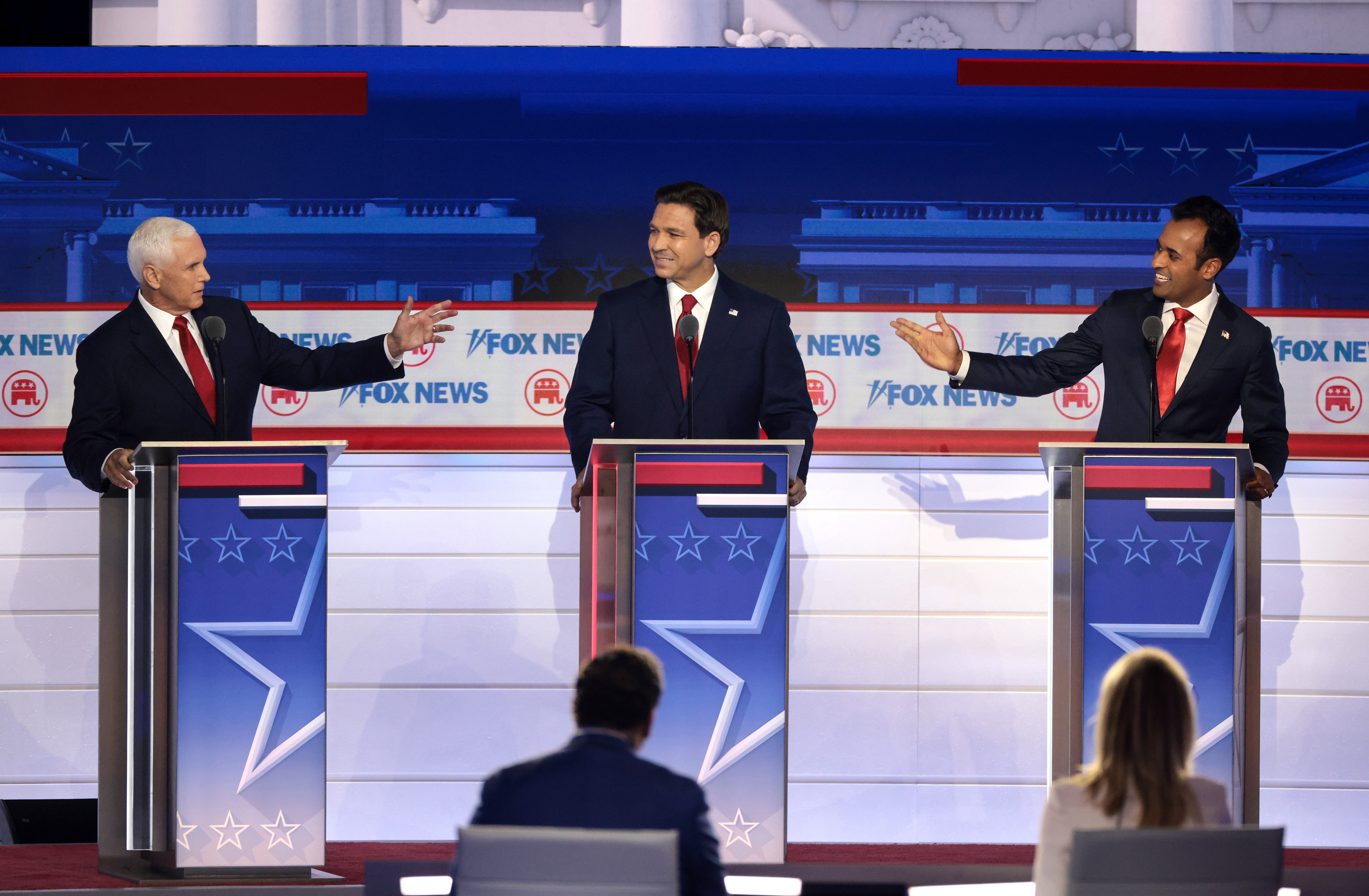 Mike Pence, Ron DeSantis and Vivek Ramaswamy argue during the debate