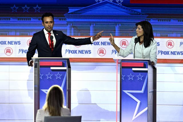 <p>Entrepreneur and author Vivek Ramaswamy (L) and former Governor from South Carolina and UN ambassador Nikki Haley gesture as they speak during the first Republican Presidential primary debate at the Fiserv Forum in Milwaukee, Wisconsin</p>