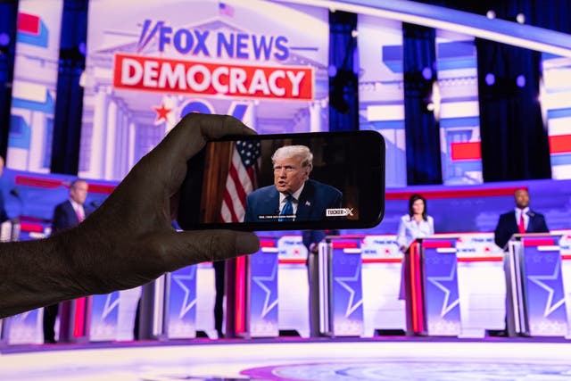 <p>A photo of Marjorie Taylor Greene watching Donald Trump during the debate circulated on Twitter</p>