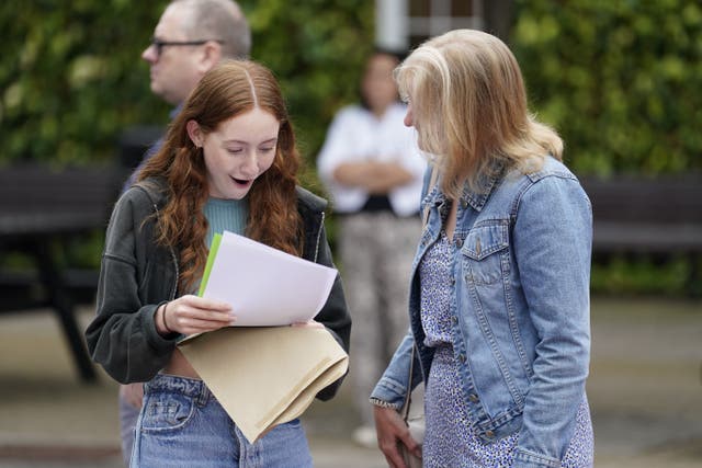 Annabel Bolton receiving her GCSE results with her mother Helen (Andrew Matthews/PA)