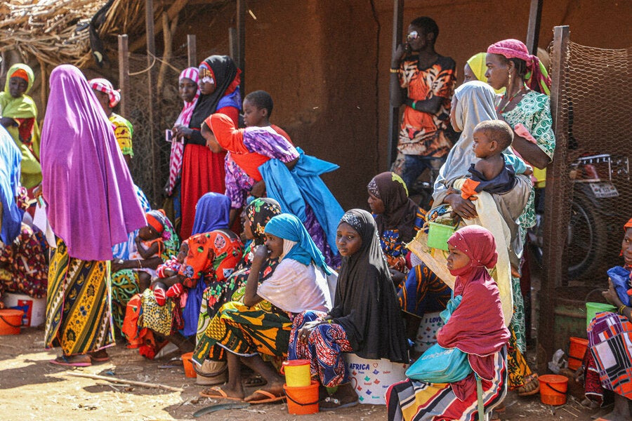 Women and children wait for rations at a WFP distribution in Niger’s Tahoua region as the country weathers a political crisis
