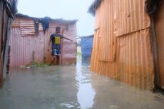 Dominican officials inspect damage inflicted by Tropical Storm Franklin after heavy flooding
