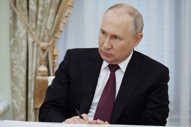 <p>Vladimir Putin in the Kremlin on Thursday </p>