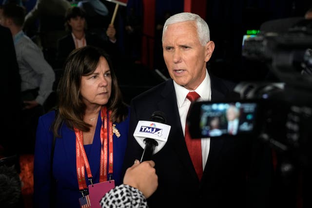 <p>Mike Pence talks to reporters at the first GOP debate </p>