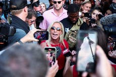 Marjorie Taylor Greene is taunted by fellow Trump fanatic at arrest rally