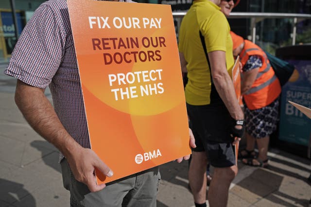 Medical consultant members of the British Medical Association on the picket line (PA)