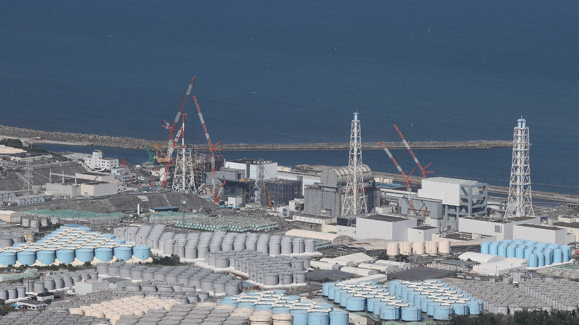 This aerial picture shows storage tanks used for storing treated water at Tepco’s crippled Fukushima Daiichi Nuclear Power Plant in Okuma, Fukushima prefecture on 24 August 2023