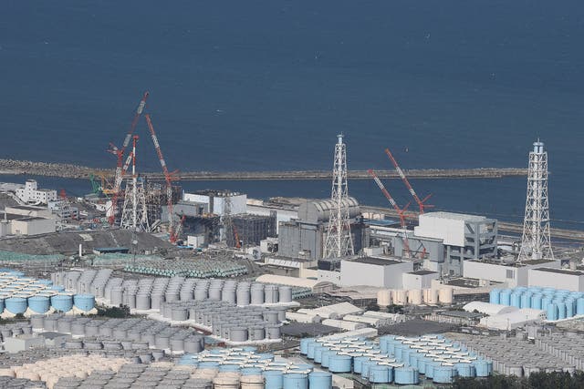 <p>This aerial picture shows storage tanks used for storing treated water at Tepco’s crippled Fukushima Daiichi Nuclear Power Plant in Okuma, Fukushima prefecture on 24 August 2023</p>