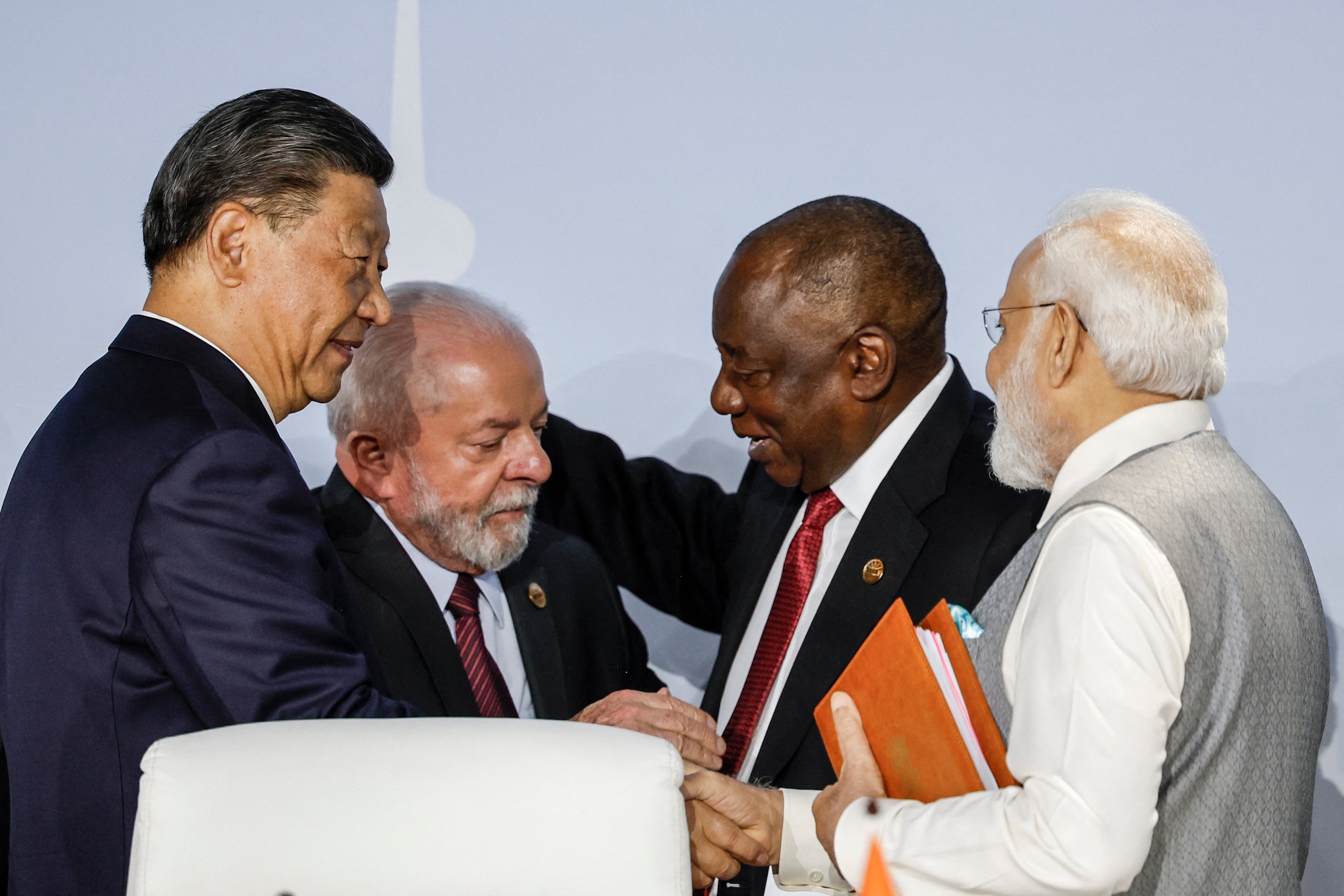 President of China Xi Jinping, President of Brazil Luiz Inacio Lula da Silva, South African President Cyril Ramaphosa and Prime Minister of India Narendra Modi gesture during the 2023 Brics