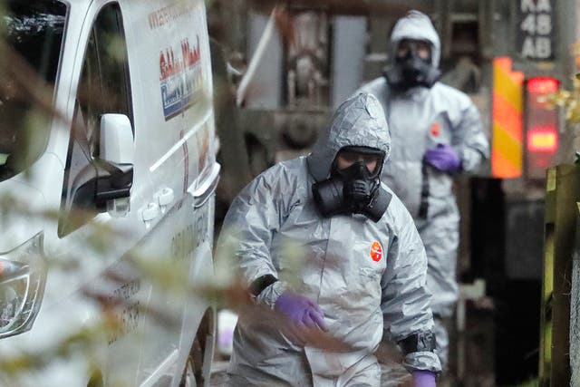 <p>Foresic examiners investigate a scene following a Russian poisoning attempt in Salisbury  </p>