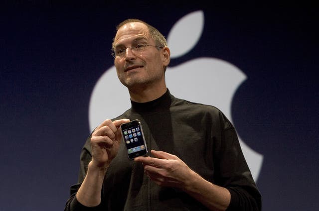 <p>Apple CEO Steve Jobs holds up the new first-generation iPhone  on 9 January 2007 in San Francisco. Apple has always been troubled by issues of efficiency and price, and that concern was the basis of its relationship with Arm from the beginning </p>