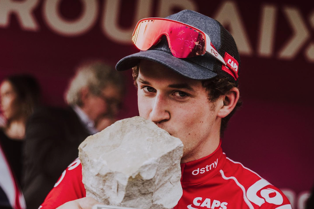 <p>Tijl De Decker poses with the under-23 Paris-Roubaix winner’s trophy</p>