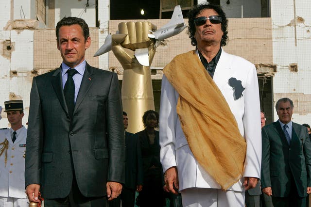 <p>Muammar Gaddafi, right, and then-president of France, Nicolas Sarkozy, in Tripoli in July 2007</p>