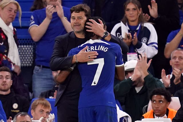 Chelsea manager Mauricio Pochettino, left, hugs Raheem Sterling after he is substituted (John Walton/PA)