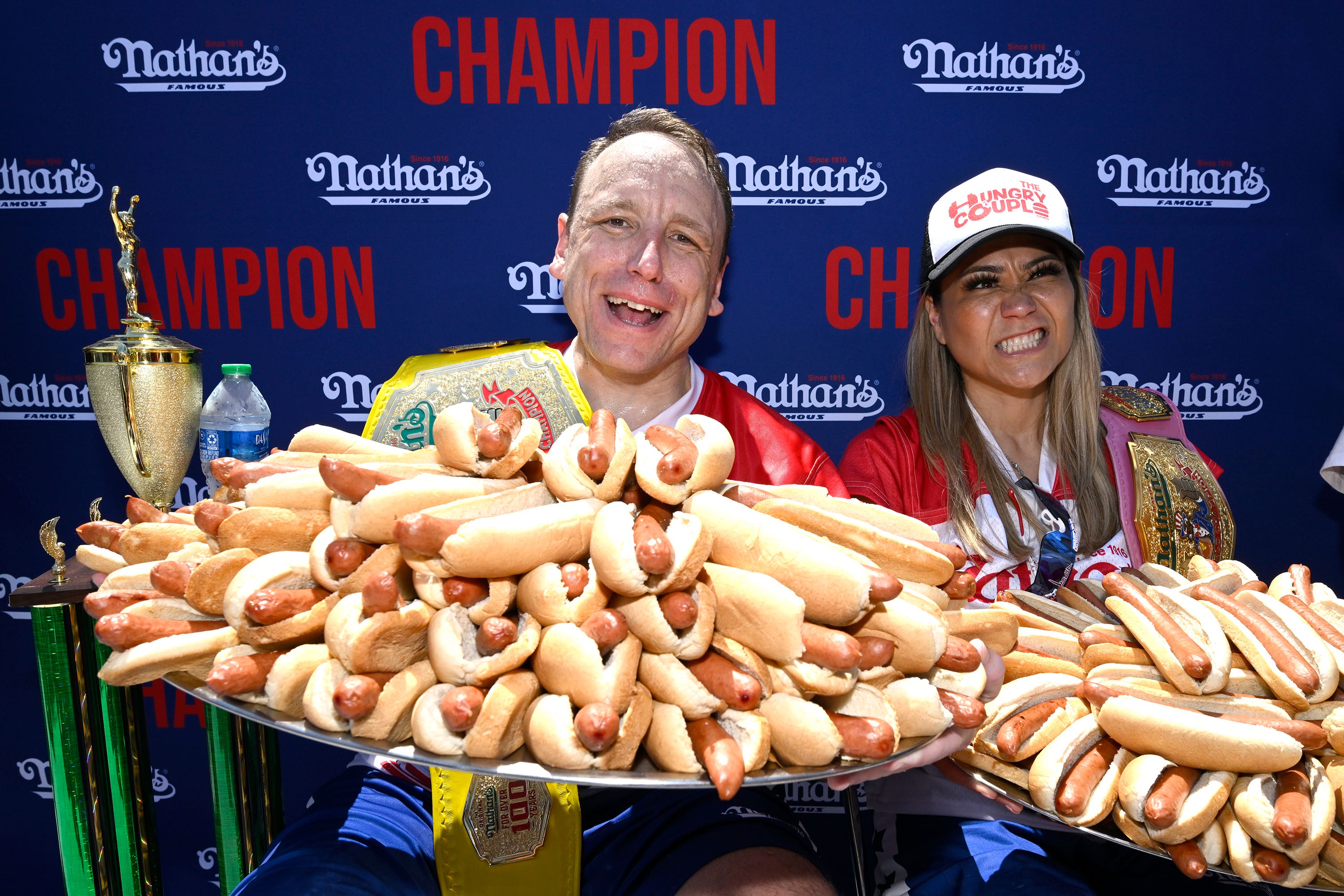 Joey Chestnut, left, and Miki Sudo, last year’s hot dog eating contest winners (Major League Eating/PA)
