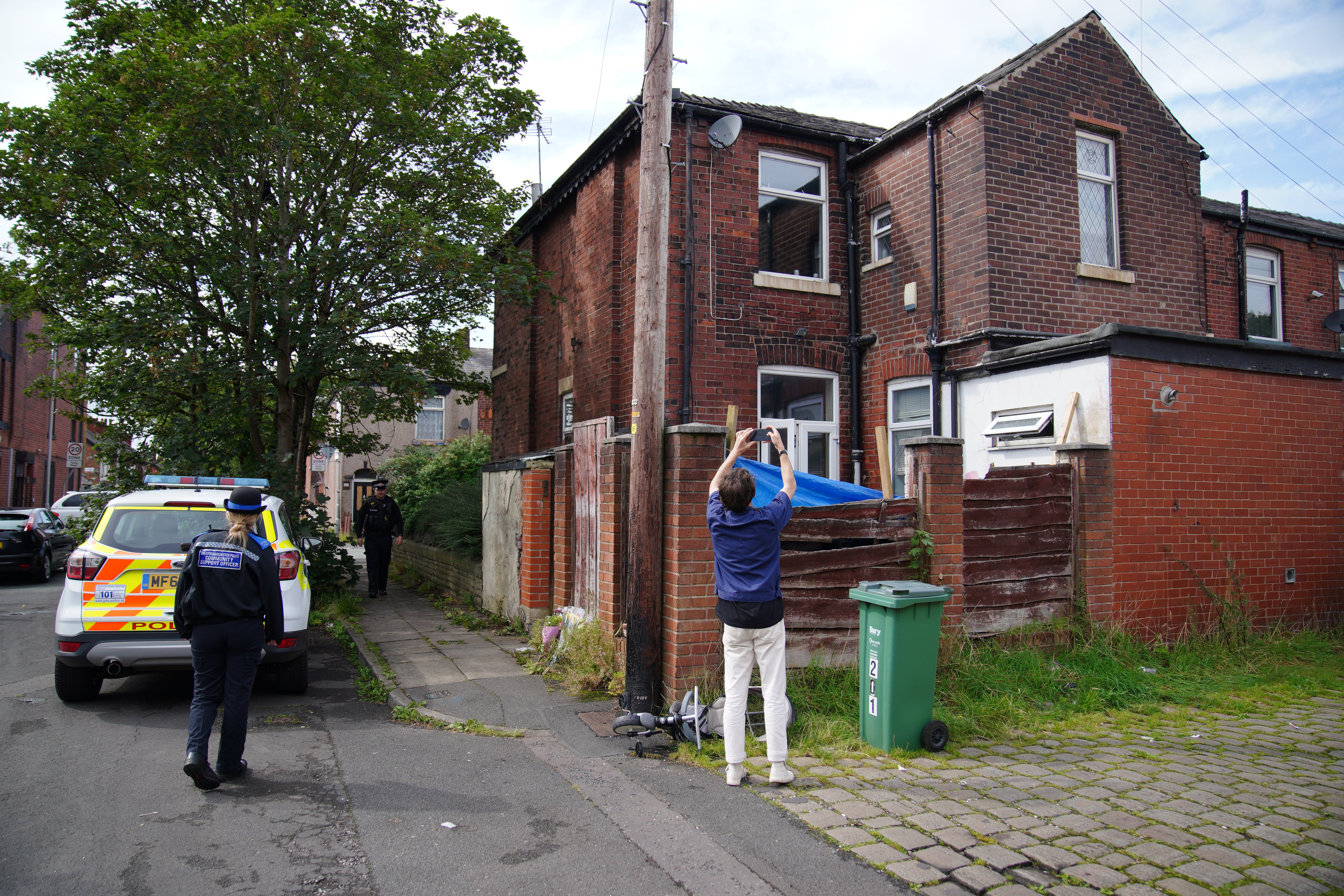 Police officers outside his property on Ainsworth Road