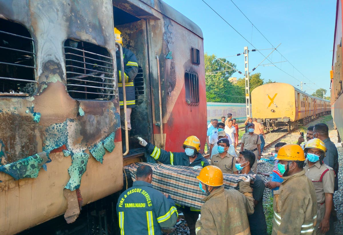 A fire inside a parked train kills 9 in southern India