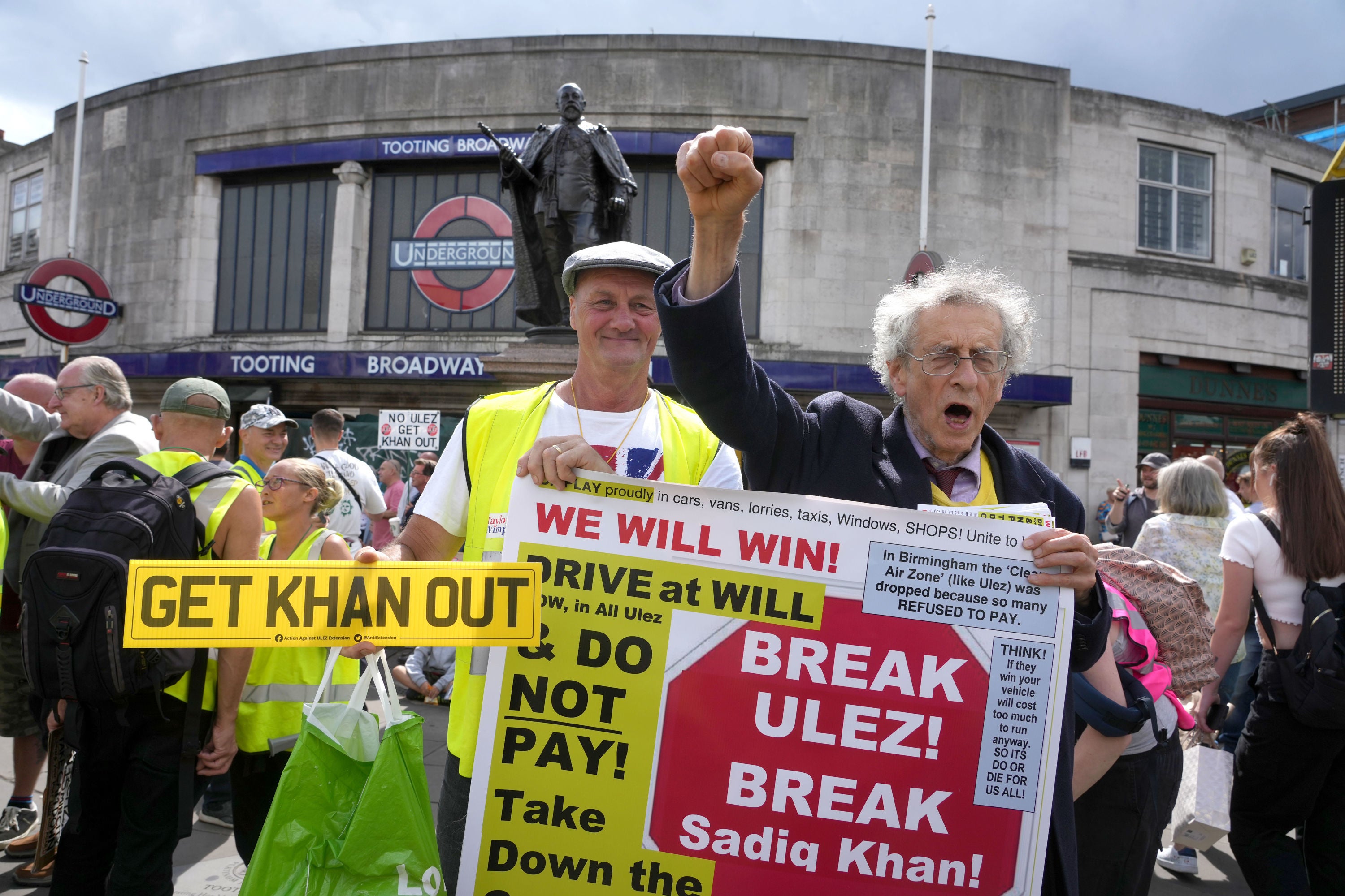 Piers Corbyn (right) joins a protest against the scheme in Tooting on Saturday