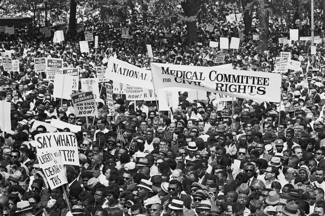 <p>Close up of demonstrators at the March on Washington for Jobs and Freedom, Washington DC, US, 28th August 1963. (Photo by Keystone/Hulton Archive/Getty Images)</p>