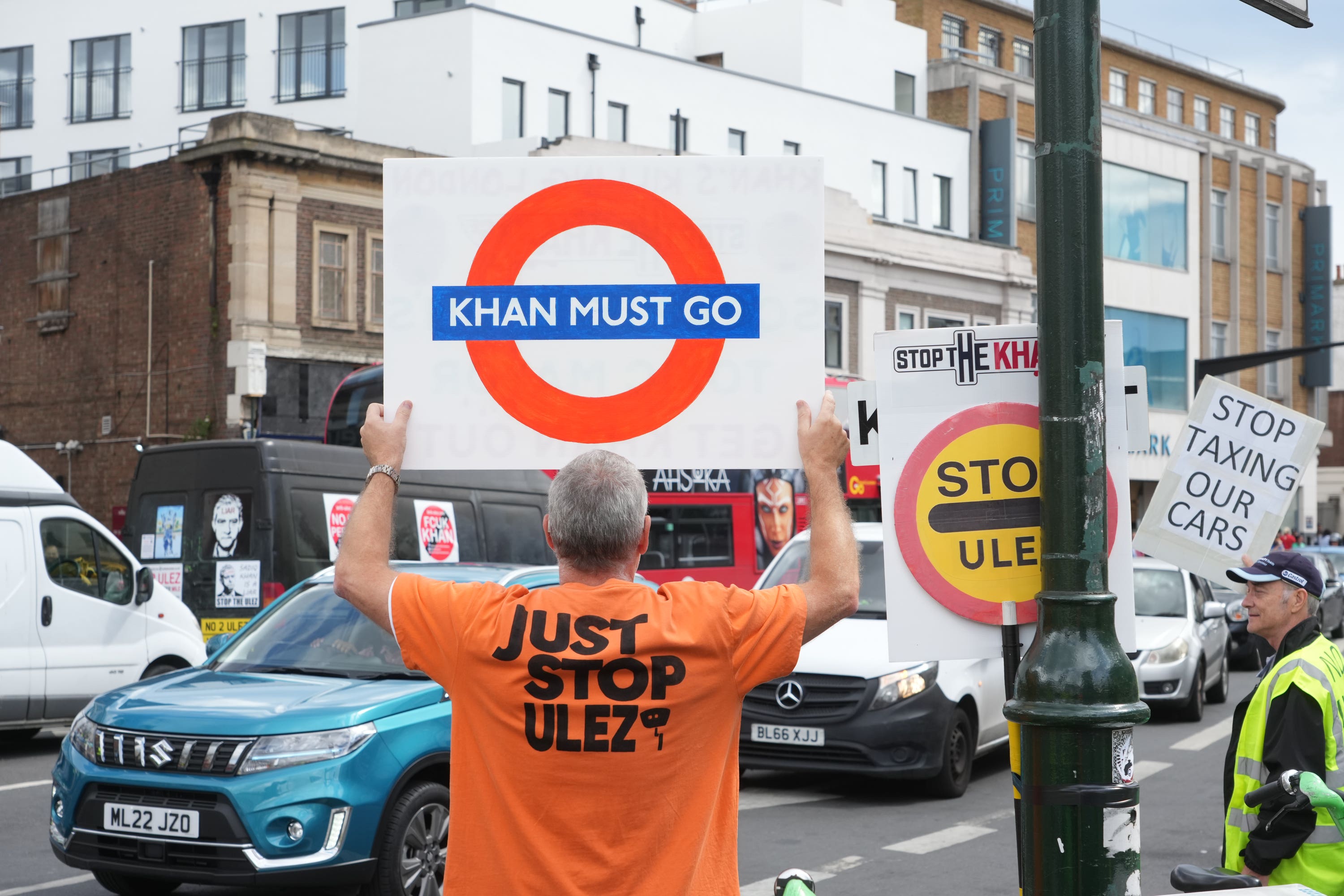 People take part in a protest against the proposed ultra-low emission zone (Ulez) expansion in Tooting, London (Jeff Moore/PA)
