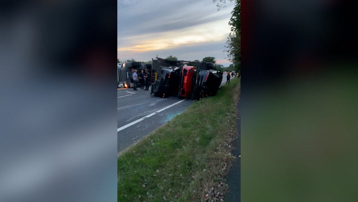 Transporter carrying nine luxury cars worth more than £1m tips over on dual carriageway near Kent