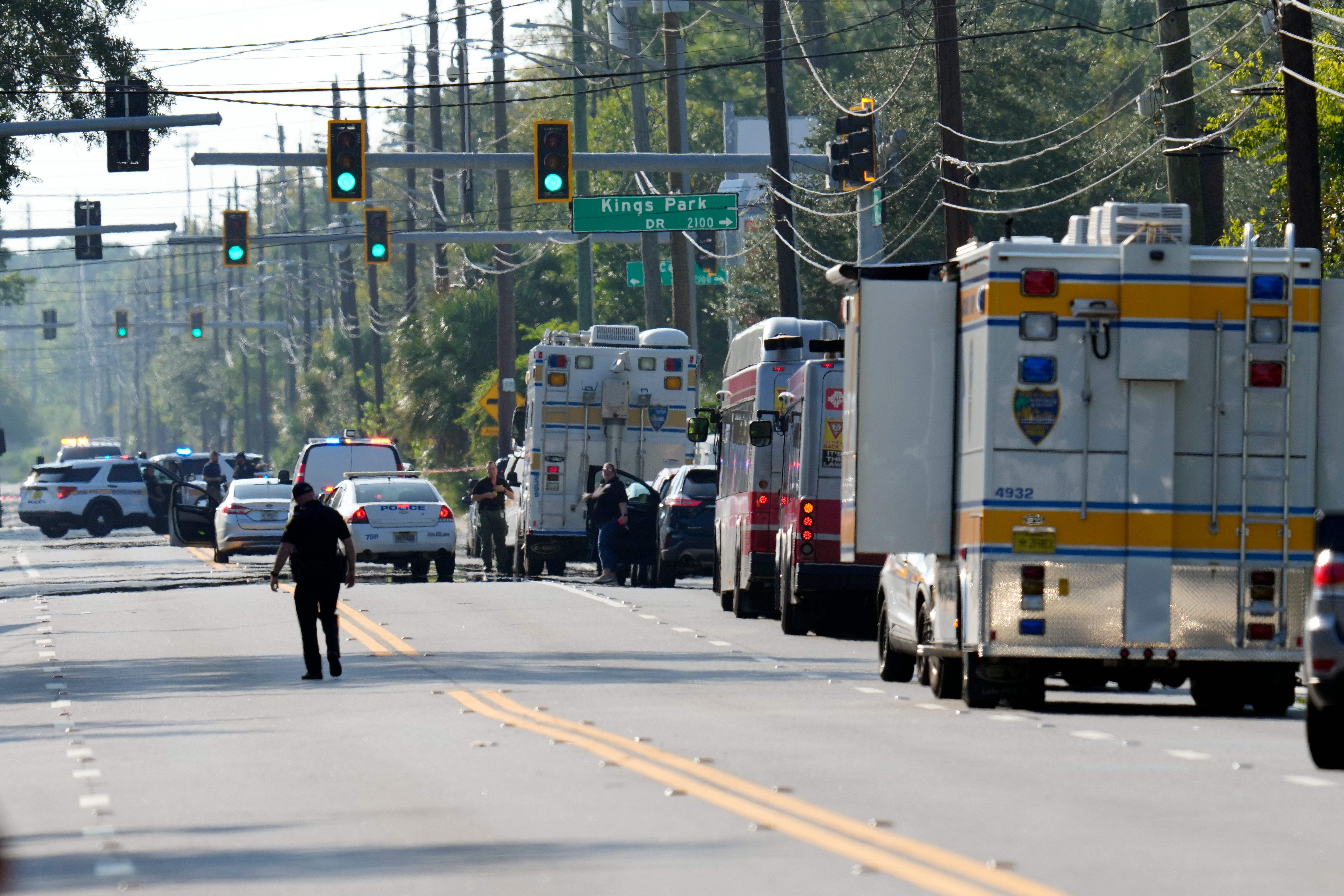 Authorities investigate the scene of a mass shooting, Saturday, Aug. 26, 2023, in Jacksonville, Fla.