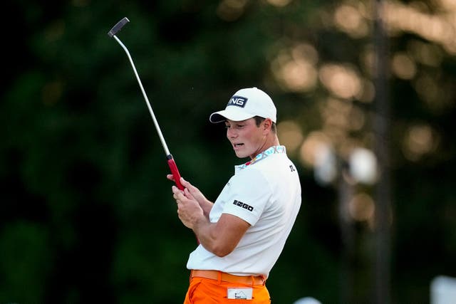 Viktor Hovland reacts to his putt on the 17th green during the third round of the Tour Championship (Mike Stewart/ AP)