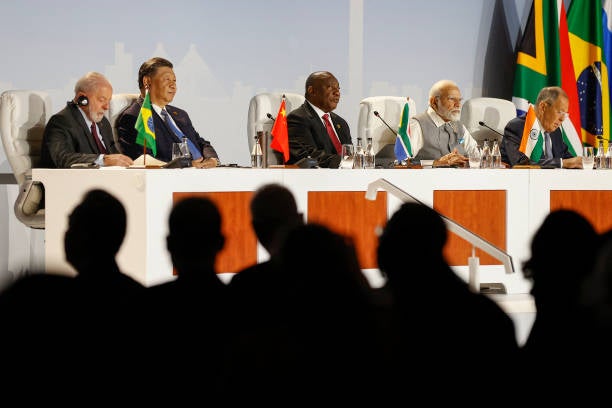 President of China Xi Jinping, president of Brazil Luiz Inacio Lula da Silva, South African president Cyril Ramaphosa and prime minister of India Narendra Modi gesture during the 2023 Brics Summit at the Sandton Convention Centre in Johannesburg on 24 August 2023
