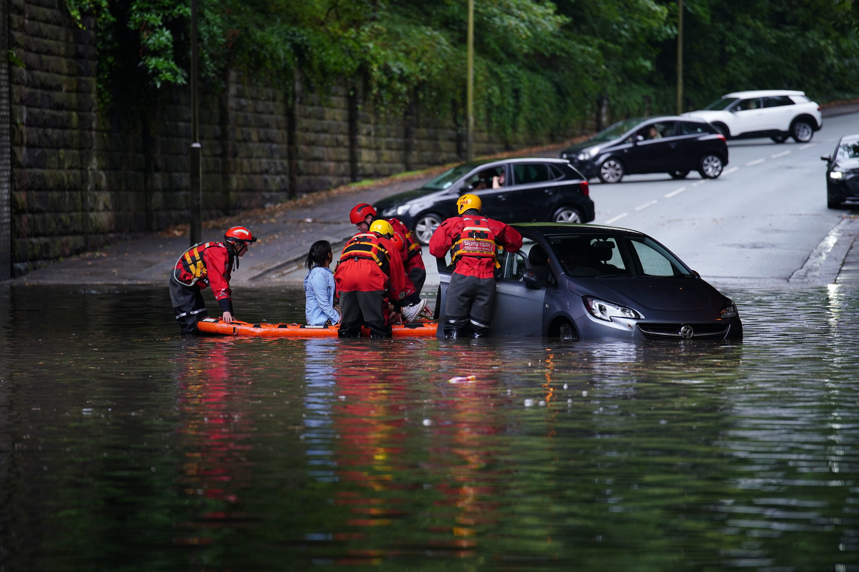 Emergency services rescued a woman from her vehicle during flooding in Mossley Hill just last month