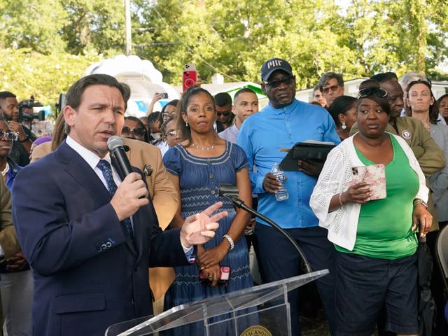 <p>Ron DeSantis speaks at a vigil in Jacksonville, Florida</p>