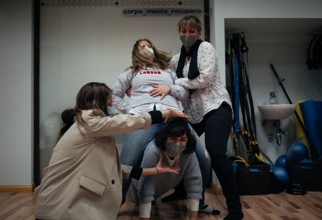<p>Loreto Ibor (C-up) and several nurses from the ICU of the San Jorge hospital in Huesca at a laughter therapy workshop offered free of charge by the Fiber-health health centre to ICU healthcare workers on March 12, 2021 in Huesca, Spain</p>
