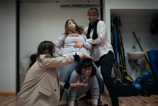 <p>Loreto Ibor (C-up) and several nurses from the ICU of the San Jorge hospital in Huesca at a laughter therapy workshop offered free of charge by the Fiber-health health centre to ICU healthcare workers on March 12, 2021 in Huesca, Spain</p>
