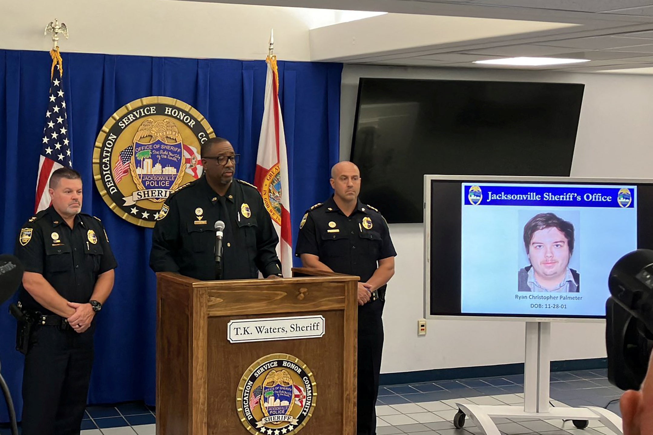 The photograph of Ryan Christopher Palmeter, 21, is shown at a news conference after being identified by Sheriff TK Waters as the white man who killed three Black people before shooting himself at a Dollar General store