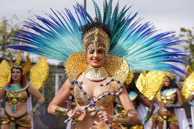 <p>Performers taking part in the Adults Day parade, part of the Notting Hill Carnival in west London over the summer bank holiday weekend</p>