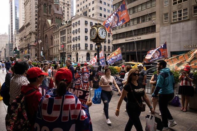<p>A clock outside Trump Tower in New York City, seen during a protest in support of the former president in June 2023</p>