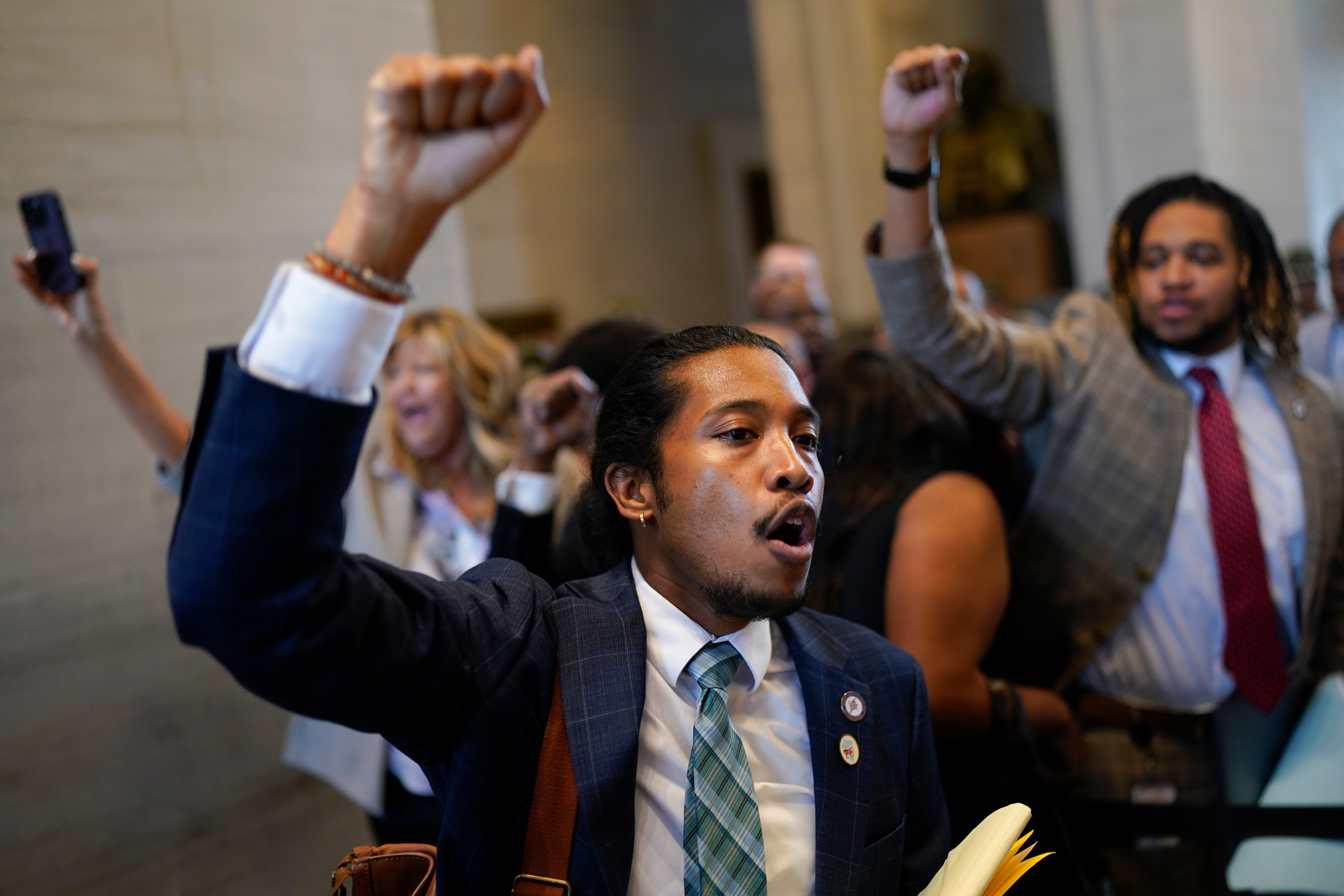 Justin Jones raises his fist to supporters outside the House chamber during a special session of the state legislature on public safety Monday, on 28 August, 2023