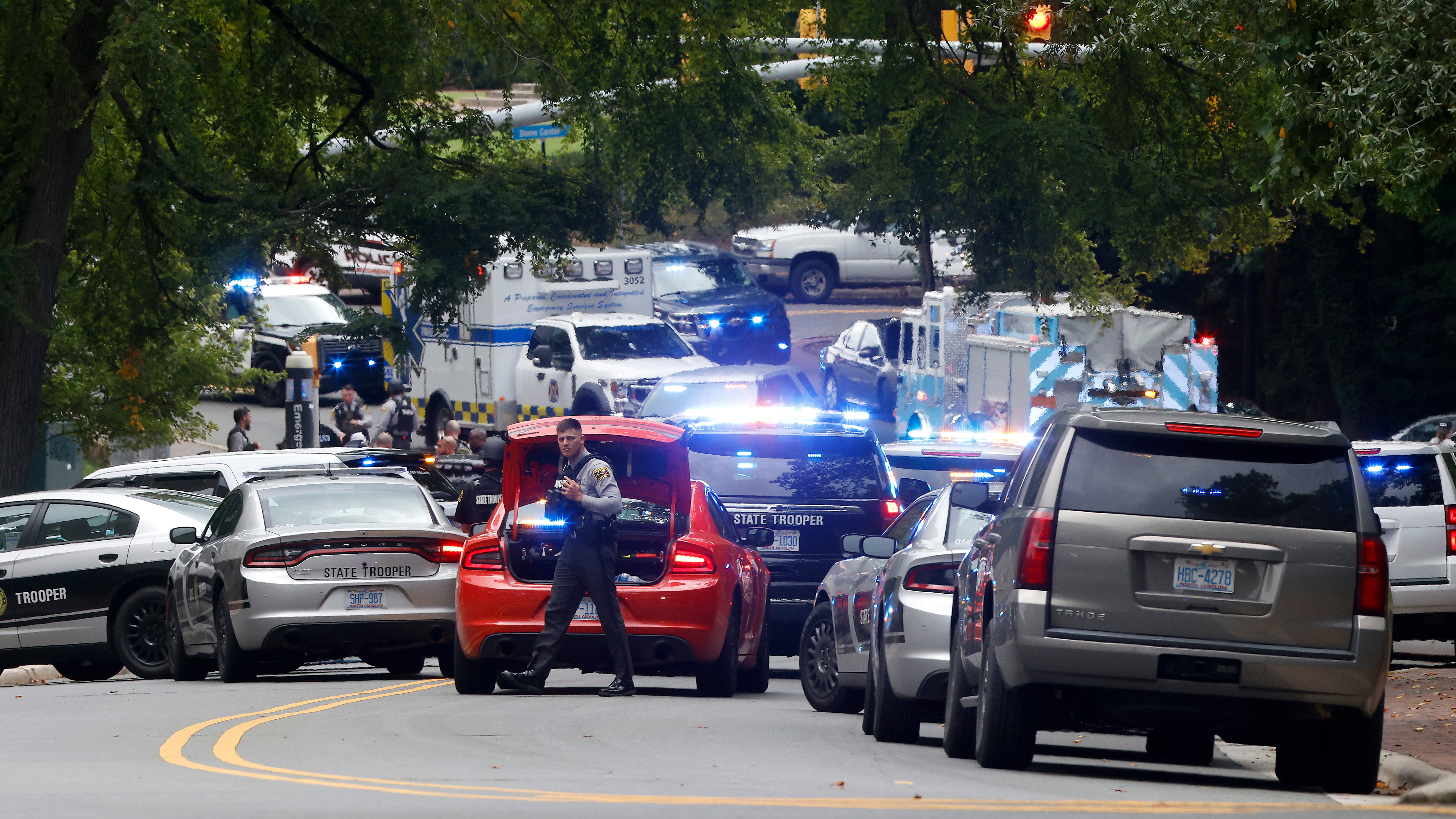 Law enforcement and first responders gather on South Street near the Bell Tower on the University of North Carolina