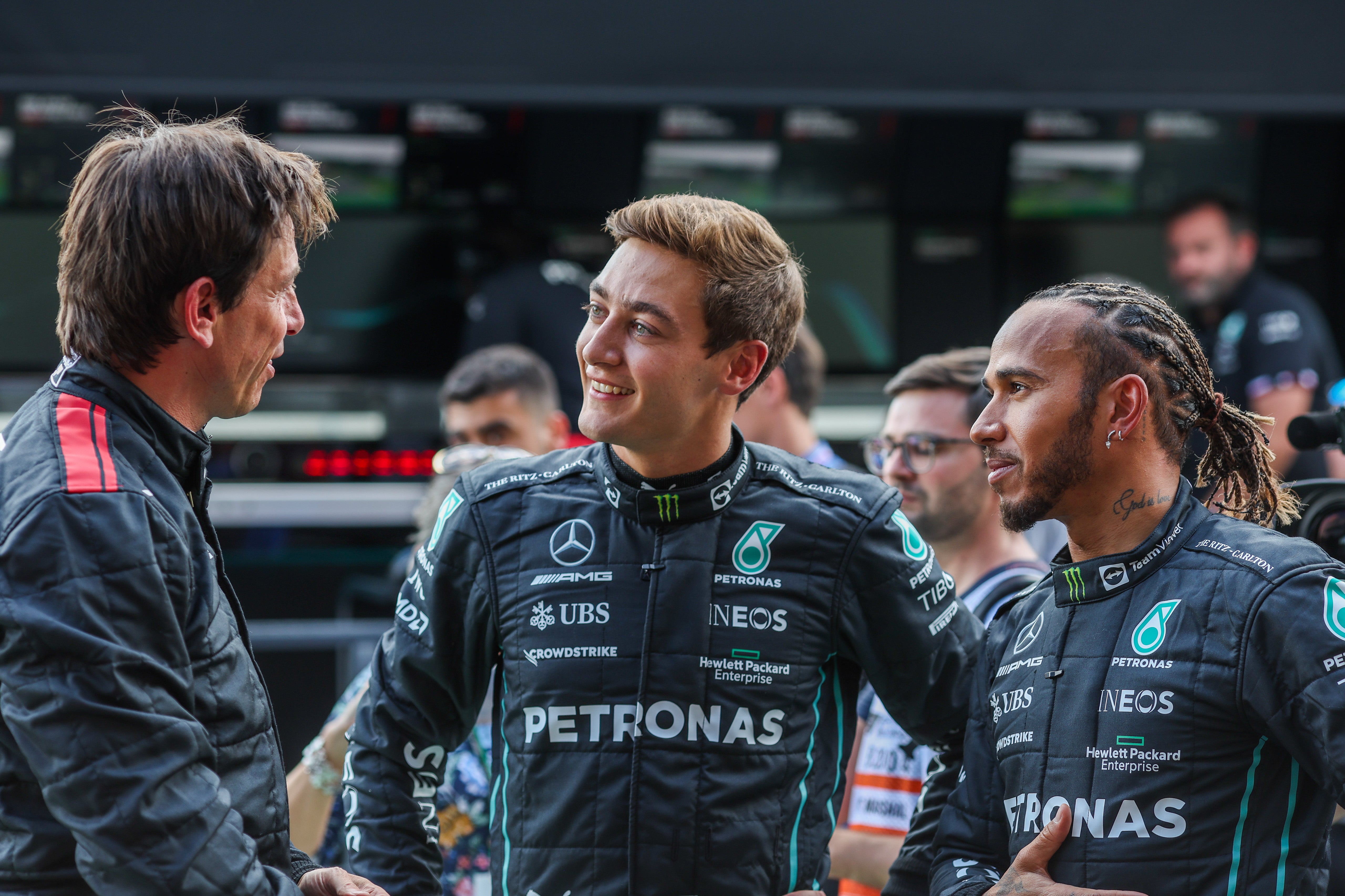 Russell and Hamilton have clashed in the absence of Mercedes boss Toto Wolff (left)