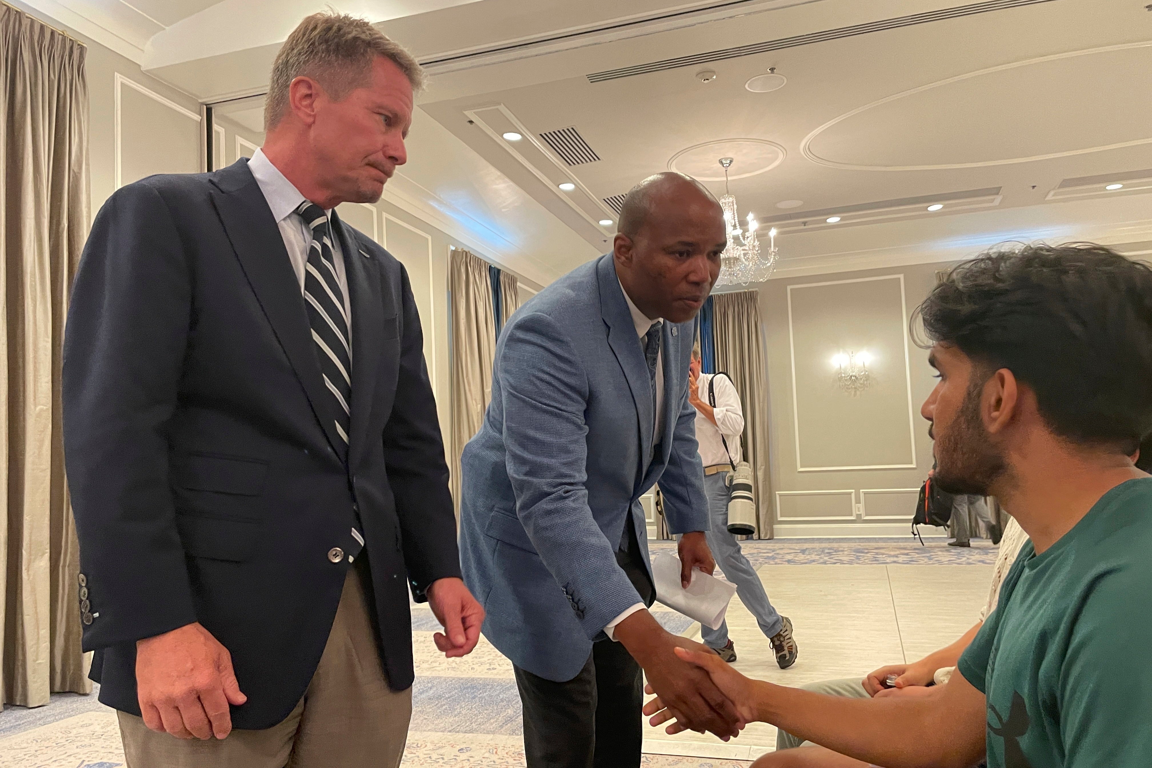 UNC-Chapel Hill Chancellor Kevin Guskiewicz, left, and UNC Chief of Police Brian James console students who had spent hours on lockdown during an active shooter situation on campus