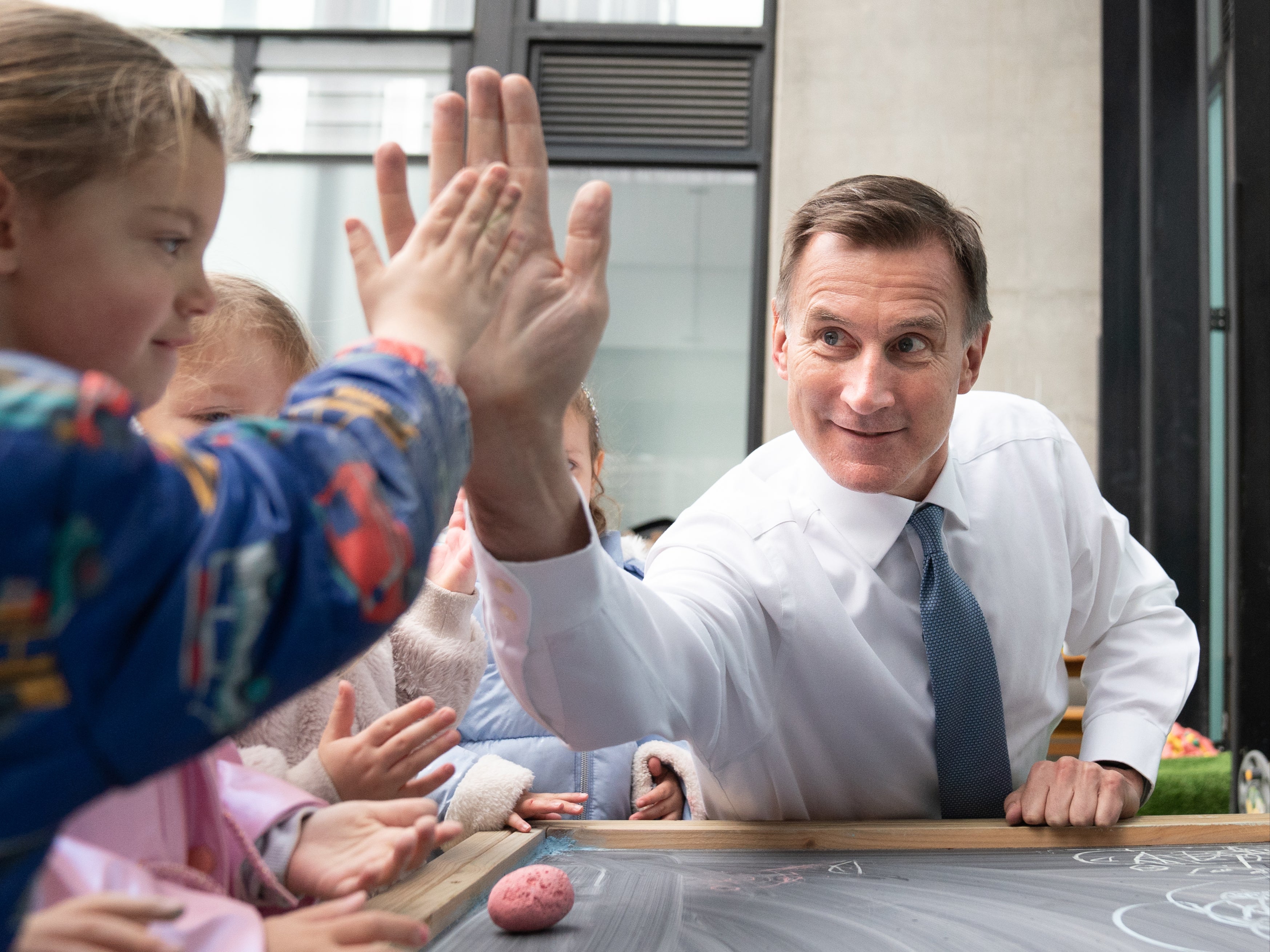 Chancellor Jeremy Hunt during a visit to Busy Bees Battersea Nursery in south London