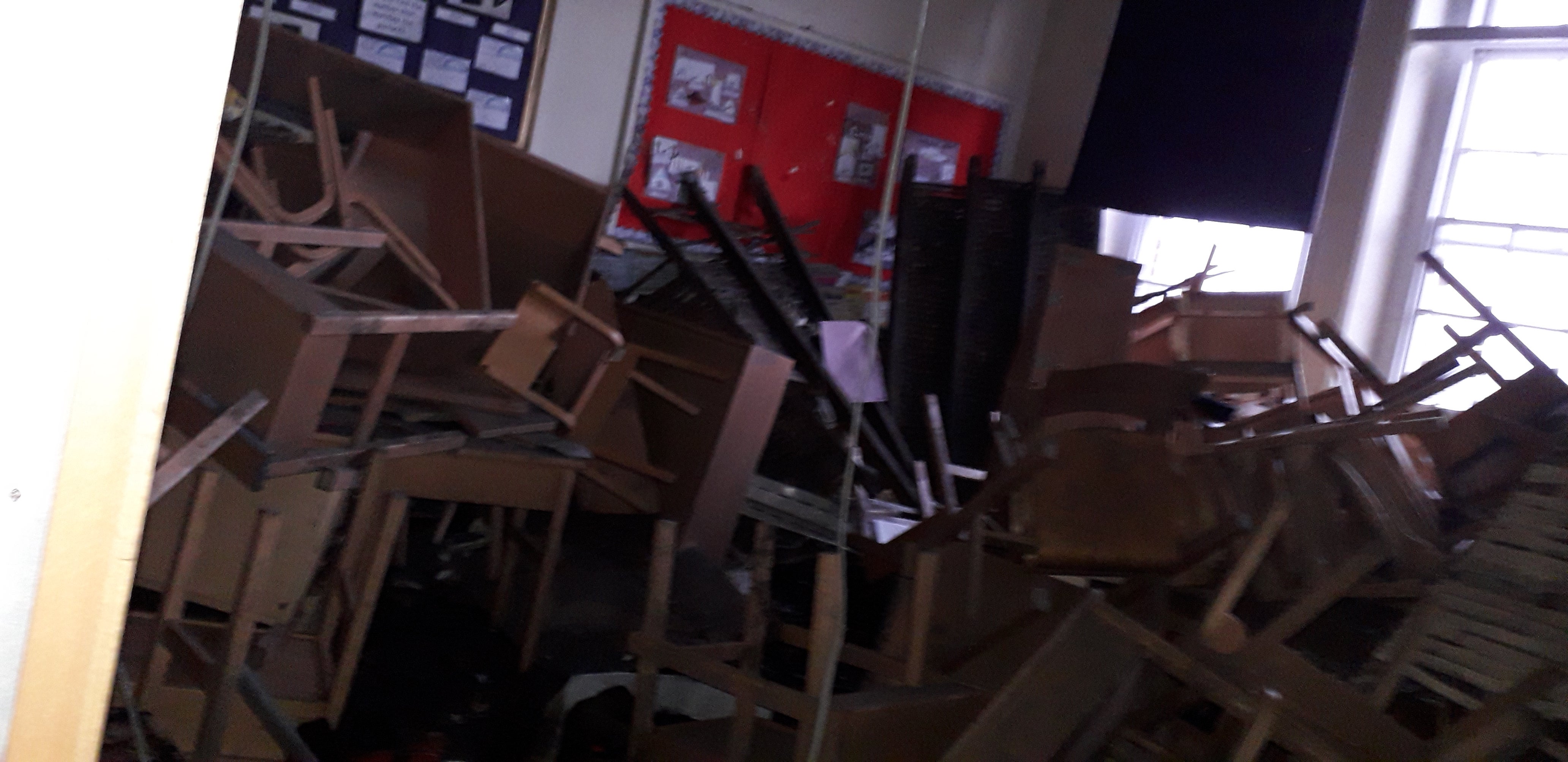 Chairs and desks stored in the attic above fell on the teacher and pupils during a lesson
