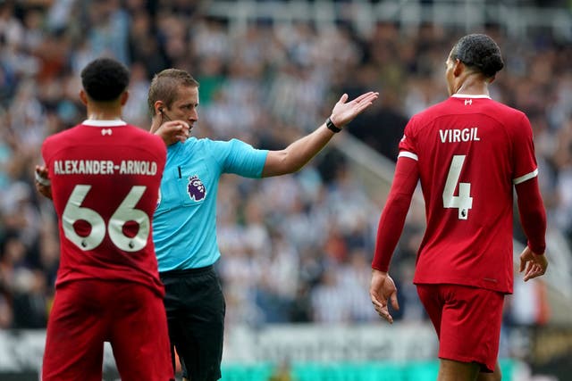 Liverpool captain Virgil van Dijk, right, has been charged with acting in an improper manner (Owen Humphreys/PA)