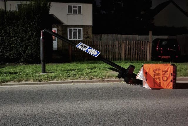 A damaged ultra-low emission zone camera lying on the road in Harefield, Uxbridge (AJ Simpson/PA)