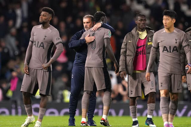 Tottenham’s Davinson Sanchez is consoled by manager Ange Postecoglou after the Carabao Cup second round defeat to Fulham (John Walton/PA)