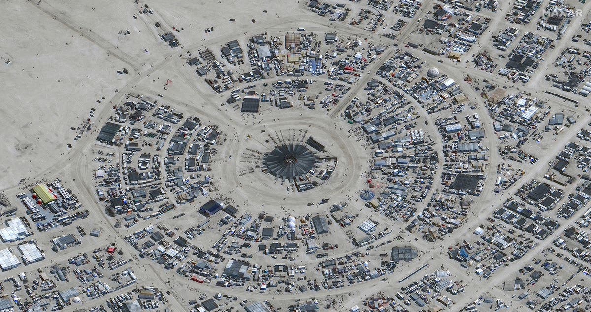 Burning Man turns to mud pit as attendees urged to shelter in place