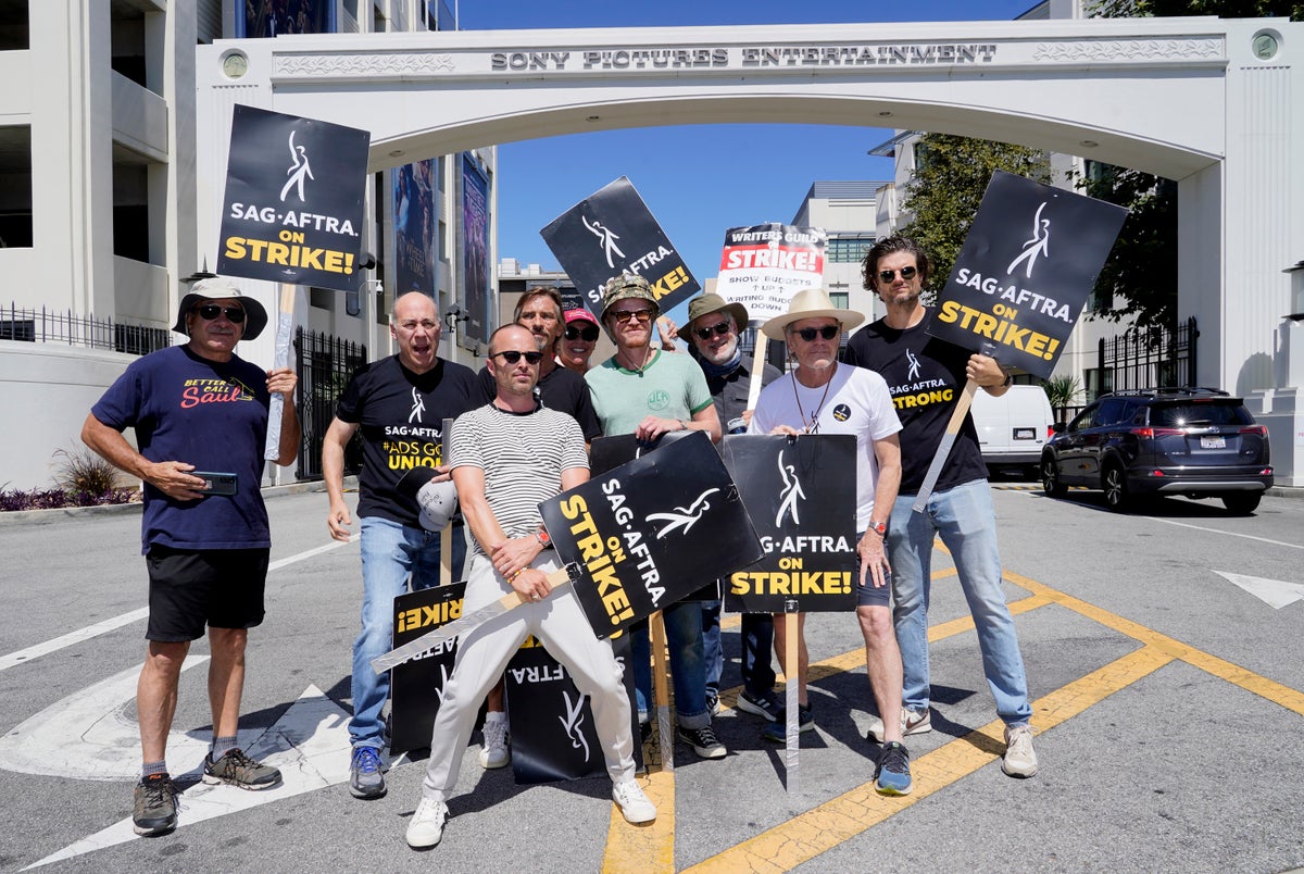 ‘It’s insane to me that I don’t get a piece from Netflix’: Breaking Bad stars reunite on actors’ strike picket line