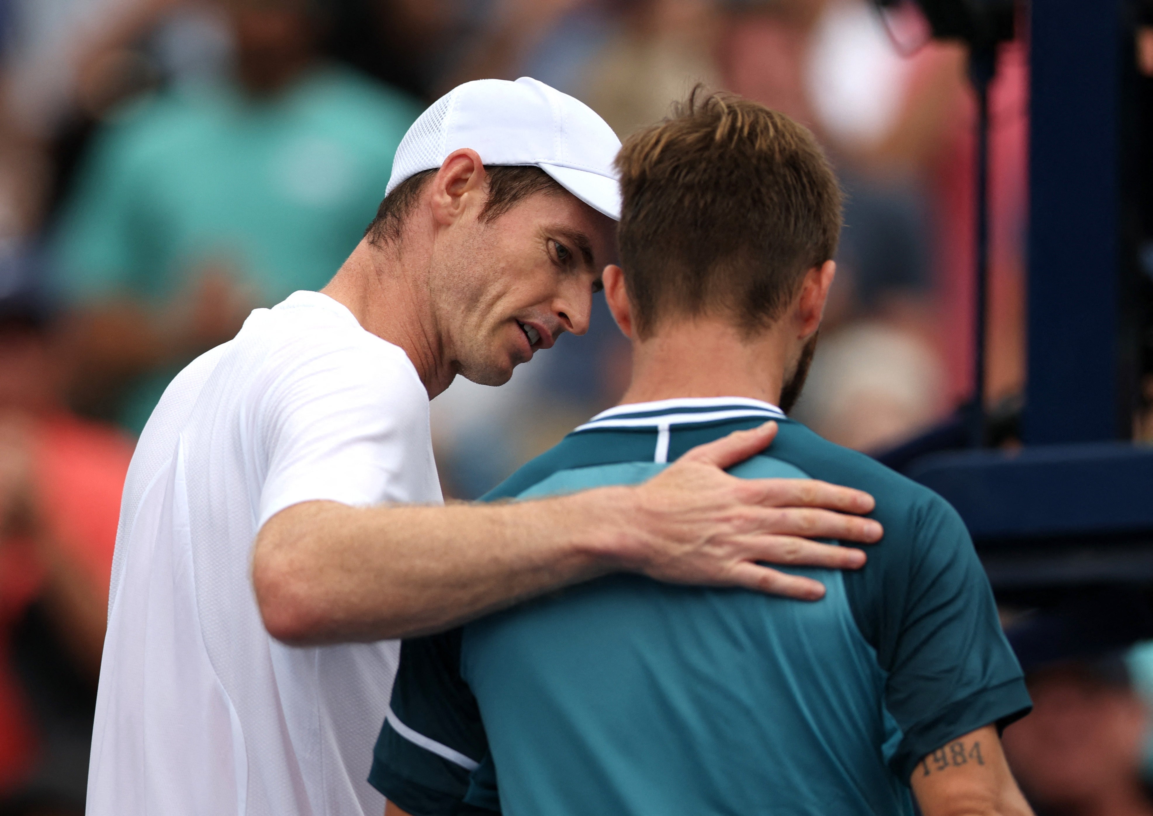 Andy Murray consoles Corentin Moutet after their first round match