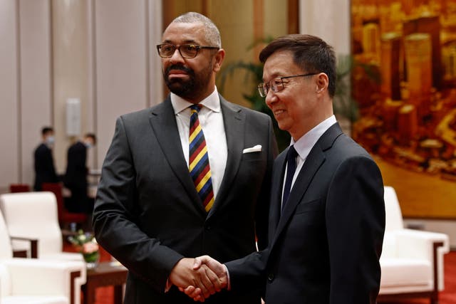 British Foreign Secretary James Cleverly, left, and Chinese Vice President Han Zheng shake hands before a meeting at the Great Hall of the People in Beijing, China Wednesday, Aug. 30, 2023. (Florence Lo/Pool Photo via AP)